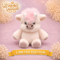 A plush toy cow from the brand Running Plusies, featuring fluffy cream-colored fur, a soft pink mane, and a pink snout, sitting on a pink textured surface with decorative floral elements in the corners and a 'LIMITED EDITION' banner at the bottom.